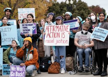 Activists demonstrate as the Supreme Court hears oral arguments on a pair of cases that could decide the future of affirmative action in college admissions, in Washington, Oct. 31, 2022