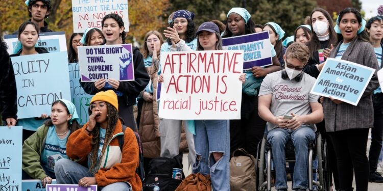 Activists demonstrate as the Supreme Court hears oral arguments on a pair of cases that could decide the future of affirmative action in college admissions, in Washington, Oct. 31, 2022