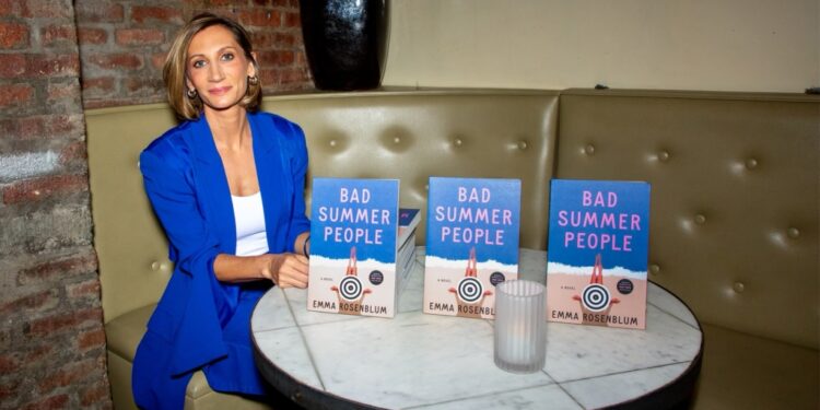 Emma Rosenblum with copies of her new book, "Bad Summer People."