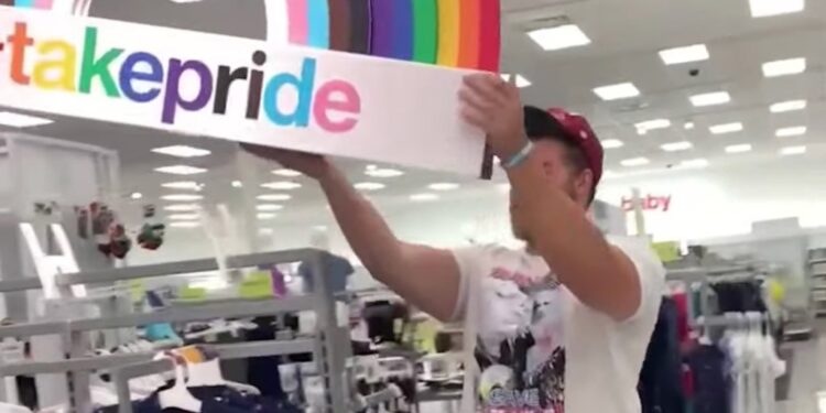 Alt-right internet personality Ethan Schmidt posted a video ripping a "#TakePride" sign from rack of Pride clothing at Target before stomping on it and kicking it.