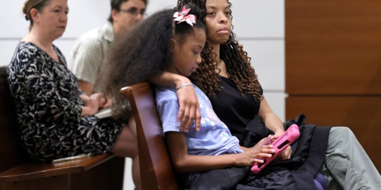 Philana Holmes and her daughter Olivia in court on Wednesday.