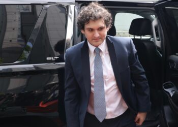 Sam Bankman-Fried exiting a car.