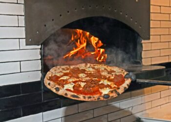 A hot pizza, fresh out of the wood fired oven at Fornino Pizzeria in Greenpoint.