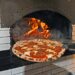 A hot pizza, fresh out of the wood fired oven at Fornino Pizzeria in Greenpoint.