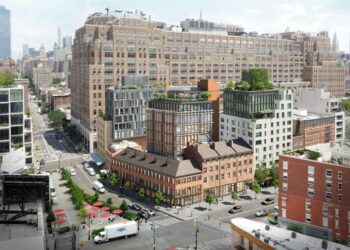 The project includes a nine-story, glass-wrapped boutique office building set behind the townhouses.