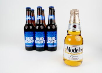 A Modelo Especial bottle in front of six Bud Light bottles.