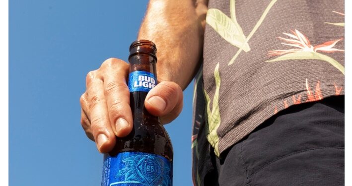 The tweet that was posted on Saturday features an image of a man holding an open bottle of Bud Light.