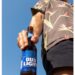 The tweet that was posted on Saturday features an image of a man holding an open bottle of Bud Light.