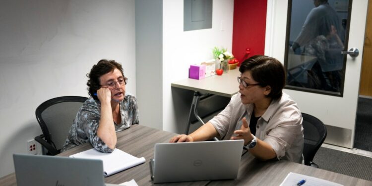 College professors are grappling with how to limit their students from utilizing ChatGPT. The above image shows Robin Kolodny (left), a political science professor, and Eunsook Ha Rhee, an associate professor of instruction, during a faculty teaching circle on artificial intelligence at Temple University in Philadelphia on Wednesday.
