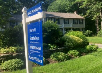 A sign noting a pending sale is shown in front of a home in Conrod, Mass.