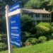 A sign noting a pending sale is shown in front of a home in Conrod, Mass.