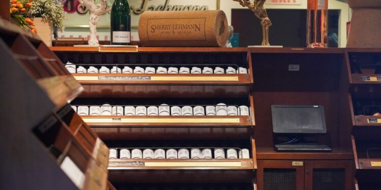 A display of wine bottles on Sherry-Lehmann shelves