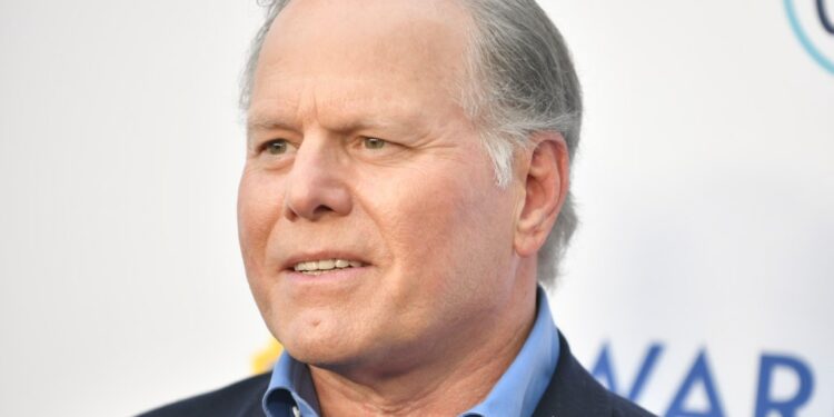 Warner Bros Discovery CEO David Zaslav said the company continues to pay down its debt and expects its streaming unit to be profitable next year, despite some headwinds including a dip in subscribers and ad revenue.