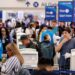 Travelers wait in line at Los Angeles International airport in June.
