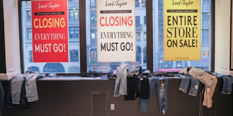 Going out of business signs in Lord & Taylor windows.