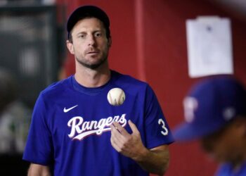Texas Rangers pitcher Max Scherzer throwing a ball in the air.