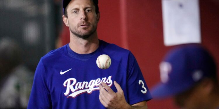 Texas Rangers pitcher Max Scherzer throwing a ball in the air.