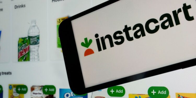 Instacart logo and webpage on a cellphone screen.