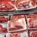 Various cuts of beef and pork in plastic wrap on a shelf at a discount market in Arlington, VA.