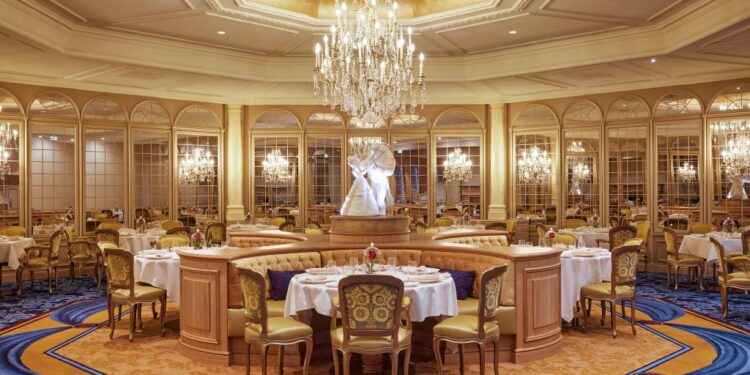 Tables and chairs in a room at Disneyland Paris's newly-refurbished five-star Disneyland Hotel, following a two-year renovation.