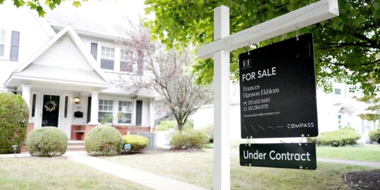Compass Real Estate 'House Under Contract' sign posted in front of a house in Hawthorne, NJ