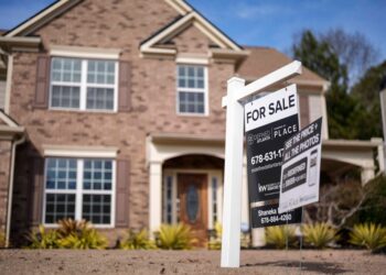 A 'For Sale' sign posted outside a house in Acworth, Georgia, relating to property tax legislation in 2024
