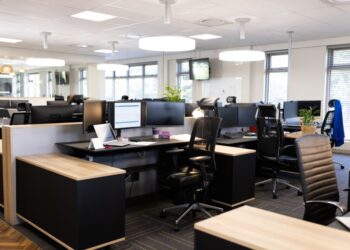 Open office space with desks, chairs, and computers
