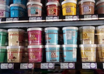 Shelf displaying containers of Enlightened low calorie ice cream at a Whole Foods store in Nashville, TN, USA on April 6th, 2018