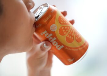 A person drinks Poppi, a prebiotic soda, on Wednesday, April 10, 2024, in New York.