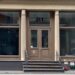 A building with a door and windows at 21 Mercer St. in Soho
