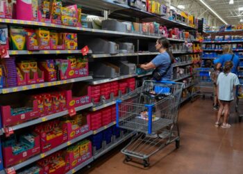 People shopping for school supplies inside a Walmart in Edmond, Oklahoma.