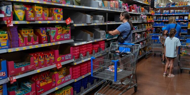 People shopping for school supplies inside a Walmart in Edmond, Oklahoma.