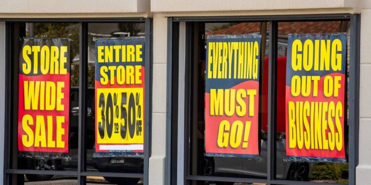 Badcock Home Furniture store on North Florida Avenue in Lakeland, Florida, with closing signs on the windows. July 26.