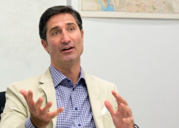 Brian Niccol, CEO of Taco Bell, speaking during an interview at The Associated Press in New York, appointed as Chipotle's CEO, gesturing with his hands.