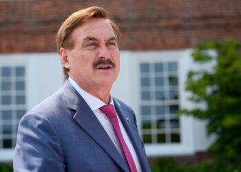 Mike Lindell, CEO of MyPillow, talks before Republican presidential nominee former President Donald Trump speaks at a news conference.