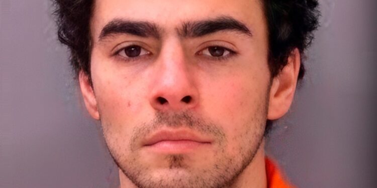 Luigi Mangione in a jumpsuit during a mugshot.