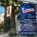 Sold sign in front of home