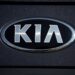The company logo shines off the hood of a 2021 K5 sedan on display in the Kia exhibit at the Denver auto show Friday, Sept. 17, 2021