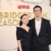 Yerin Ha and Luke Thompson attend the "Bridgerton: Season Of Love" fan event at Raffles London at The OWO on February 14, 2025 in London, England in black outfits