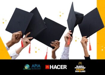 A group of hands holding graduation caps celebrating McDonald's 2024-2025 scholarship applications