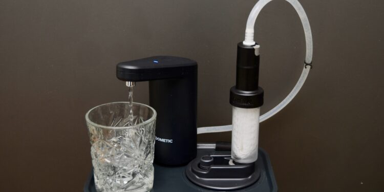 A double-tap of the Dometic Go faucet produces clean drinking water from the LifeStraw filter snapped into the Go jug.