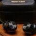 A hands-on photo of the Technics AZ100 earbuds.
