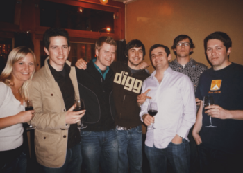 A photo of seven people drinking wine.