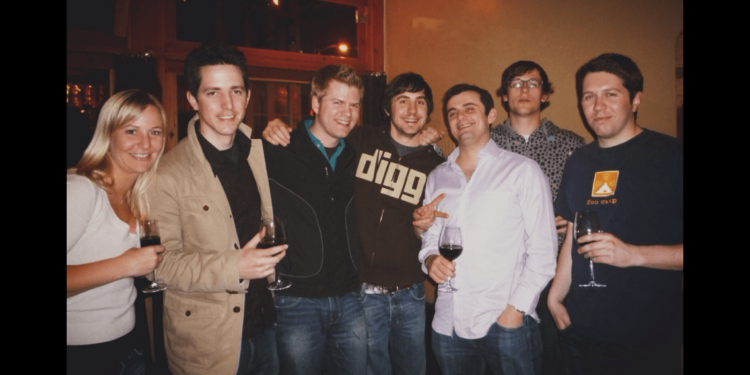 A photo of seven people drinking wine.