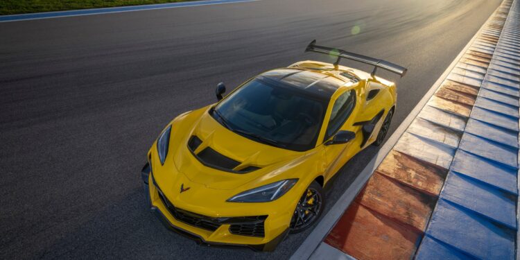 Front aerial shot of the Chevrolet Corvette ZR1 coupe in Competition Yellow with optional ZTK Performance Package on the race track. Preproduction model shown. Actual production model may vary.