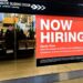 Hiring sign displayed at a retail store in Mount Prospect, Illinois.