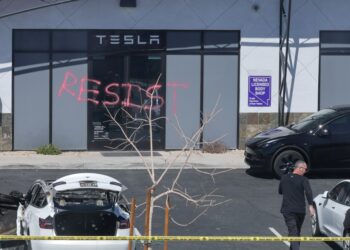 US attorney general re-announces ‘severe’ charges against alleged Tesla arsonists