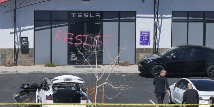 US attorney general re-announces ‘severe’ charges against alleged Tesla arsonists