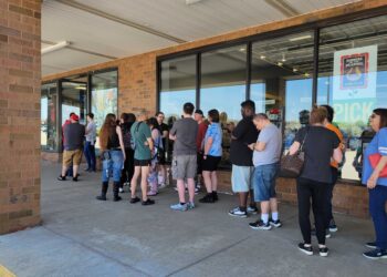 Photo capturing a line of about 20 people waiting outside a Gamestop in Akron, Ohio to preorder a Switch 2