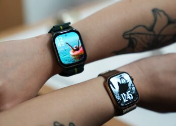 Over the shoulder view of the Moto Watch Fit (top) and the Apple Watch Series 10 (bottom).